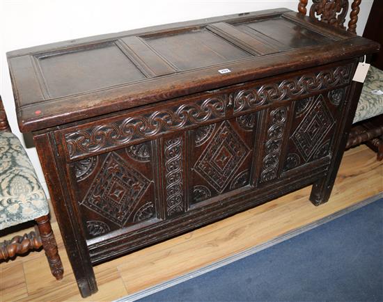An early 18th century carved oak coffer, W.119cm